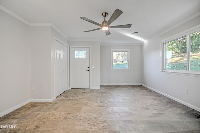 foyer featuring ornamental molding and ceiling fan