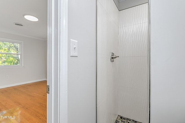 room details featuring ornamental molding and hardwood / wood-style floors