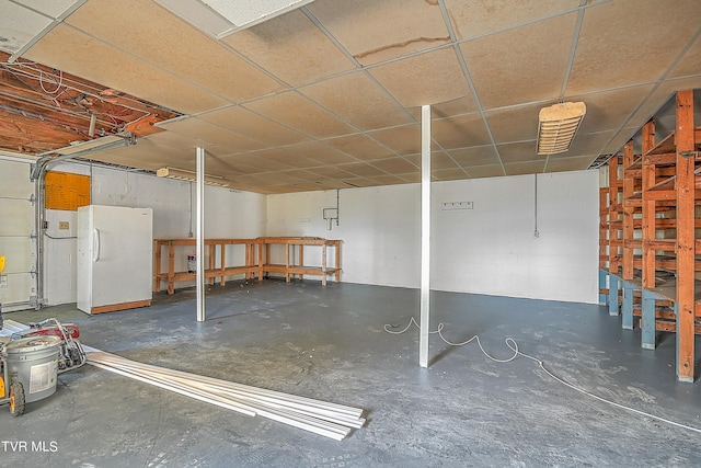 garage with white fridge