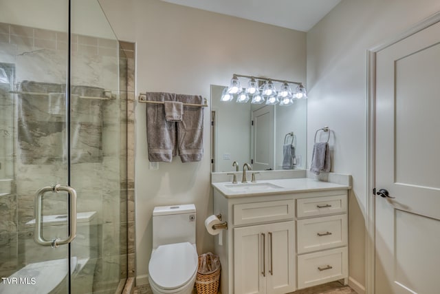 bathroom featuring walk in shower, vanity, and toilet