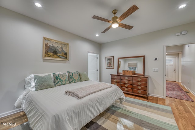 bedroom featuring hardwood / wood-style floors and ceiling fan