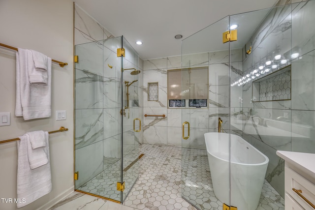 bathroom with separate shower and tub, vanity, and tile walls