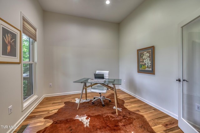 home office featuring hardwood / wood-style floors