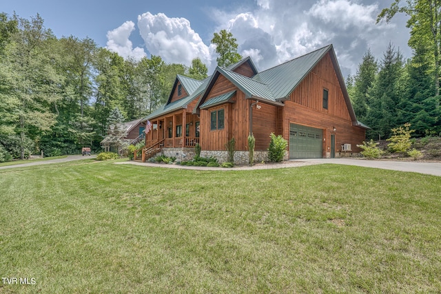 log cabin with a front yard, a garage, and a porch