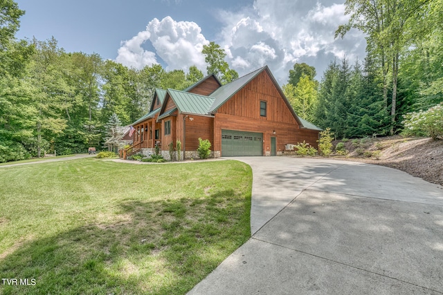 view of front of property featuring a garage and a front lawn