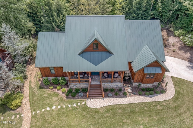 exterior space featuring a yard and covered porch