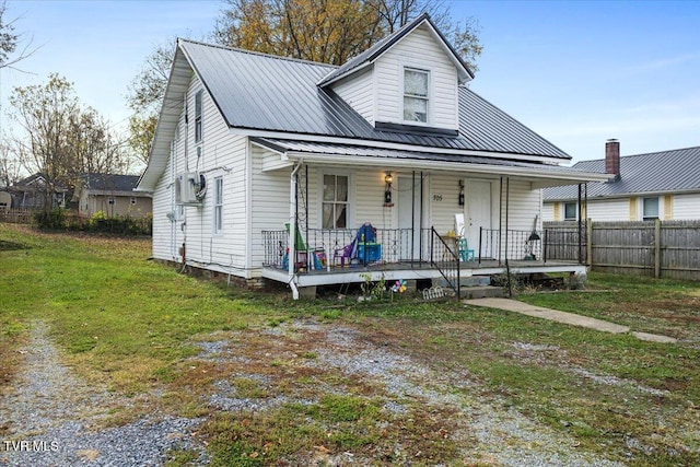 view of front of home with a front yard and a porch