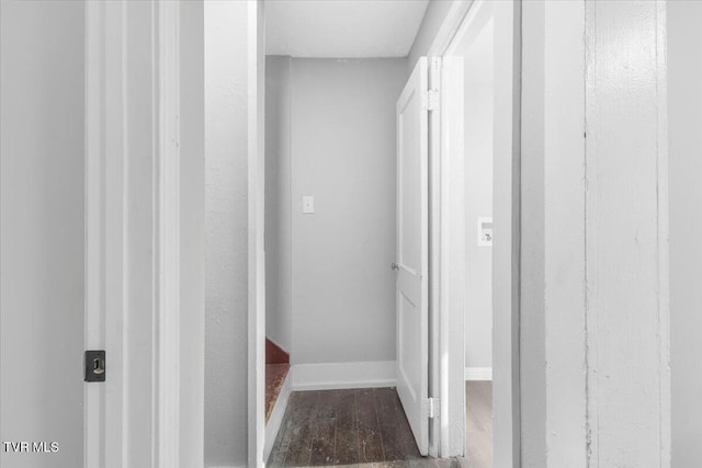 corridor featuring dark wood-type flooring