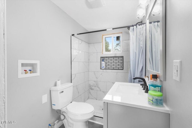 bathroom featuring vanity, a shower with shower curtain, and toilet