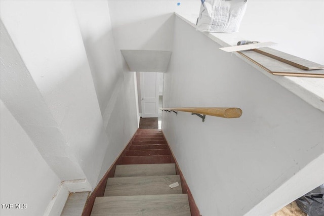 stairway featuring hardwood / wood-style flooring