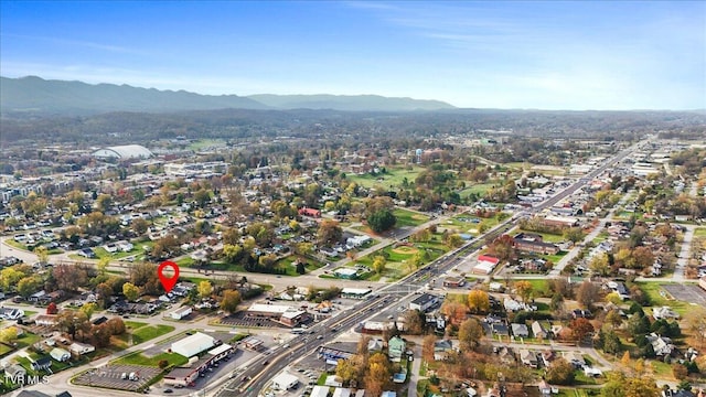 birds eye view of property featuring a mountain view