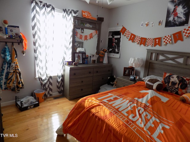 bedroom with light wood-type flooring