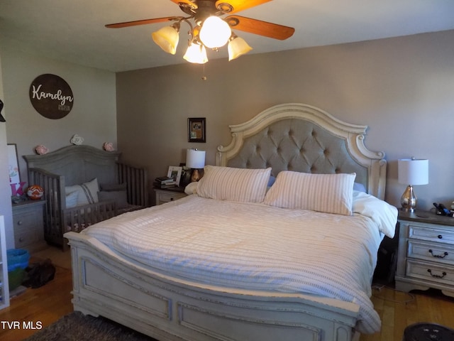 bedroom featuring ceiling fan and wood-type flooring