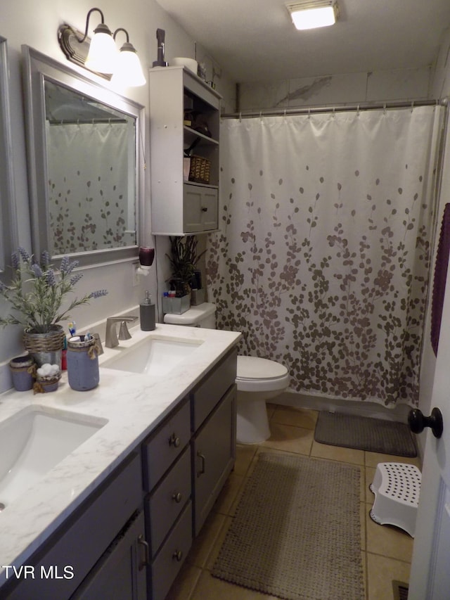 bathroom featuring a shower with curtain, tile patterned floors, vanity, and toilet