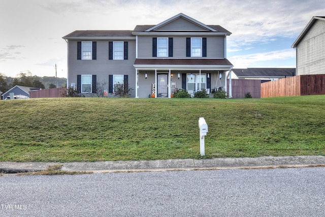 view of front of house with a front lawn and covered porch