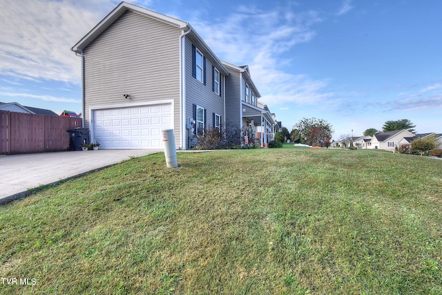 view of property exterior with a lawn and a garage