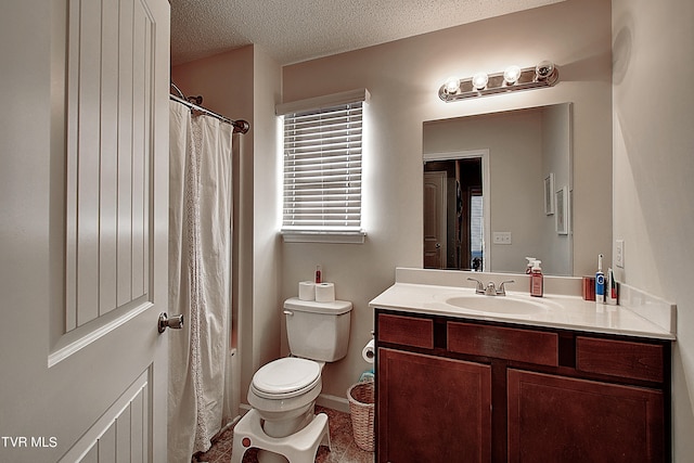 bathroom featuring vanity, a textured ceiling, tile patterned floors, toilet, and a shower with shower curtain