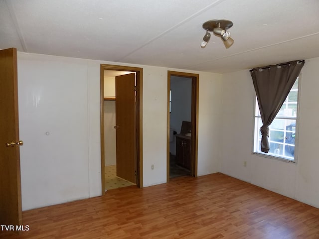 unfurnished room featuring light hardwood / wood-style flooring