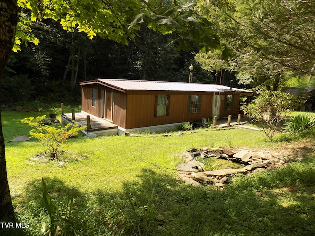 view of home's exterior with a lawn