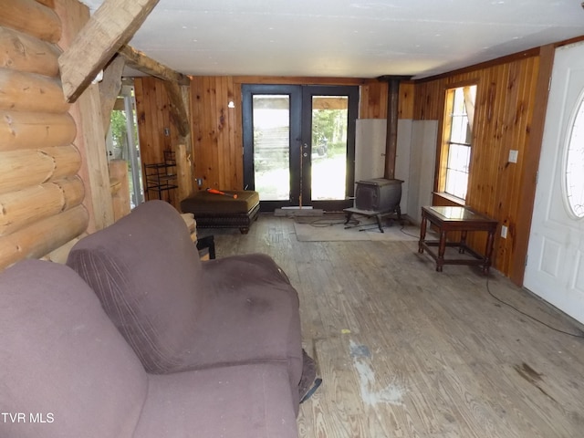 living room featuring hardwood / wood-style floors and a wood stove