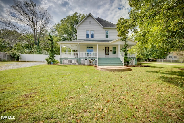 farmhouse-style home featuring a porch and a front lawn