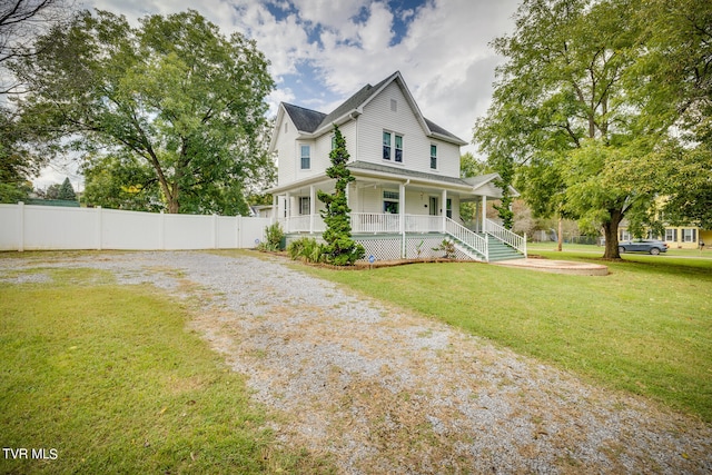 view of front of house with a front lawn and covered porch