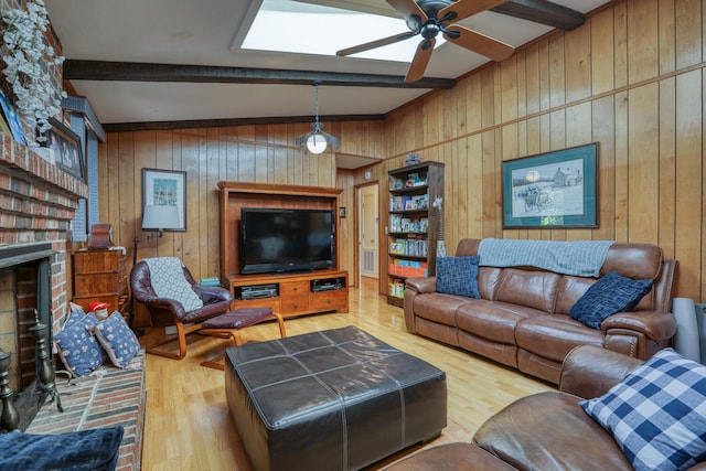 living room with hardwood / wood-style flooring, a fireplace, lofted ceiling with beams, and wood walls