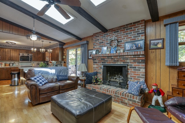 living room with a brick fireplace, wooden walls, lofted ceiling with beams, and light hardwood / wood-style flooring