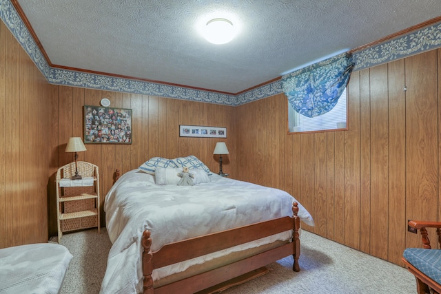 carpeted bedroom featuring a textured ceiling, wood walls, and ornamental molding