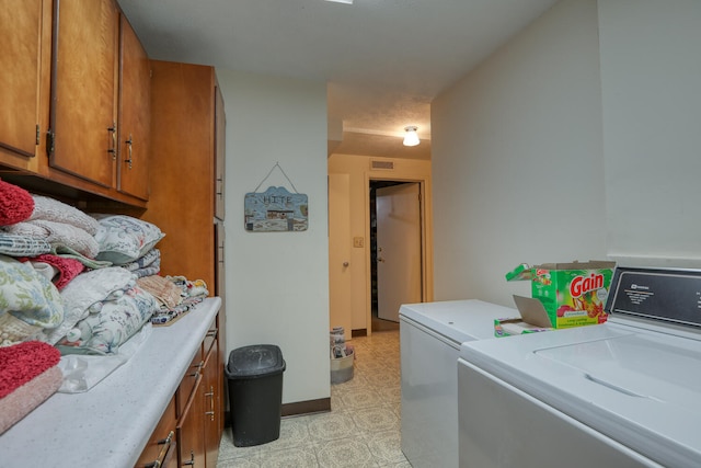 washroom with independent washer and dryer