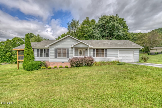 ranch-style home with a garage and a front lawn