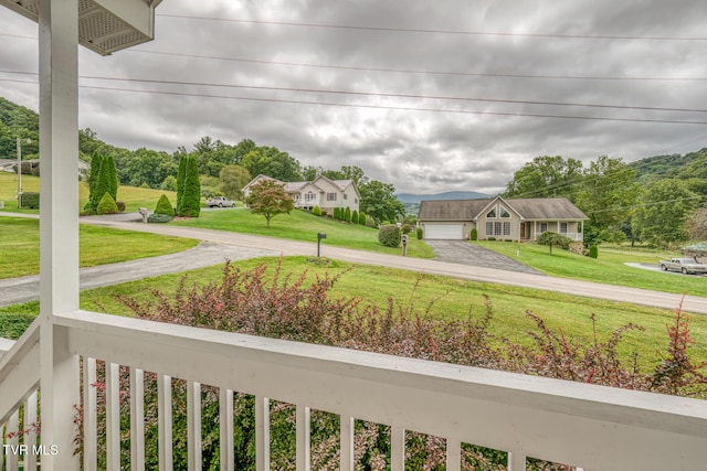 view of yard with a balcony