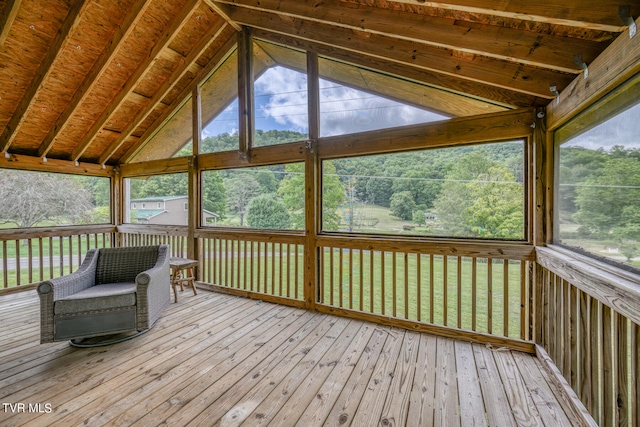 unfurnished sunroom with vaulted ceiling