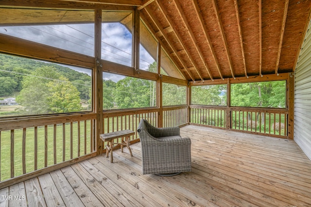 unfurnished sunroom with vaulted ceiling