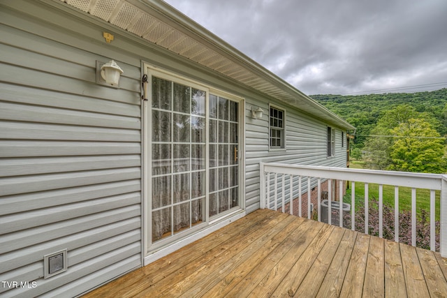 wooden terrace with central AC unit