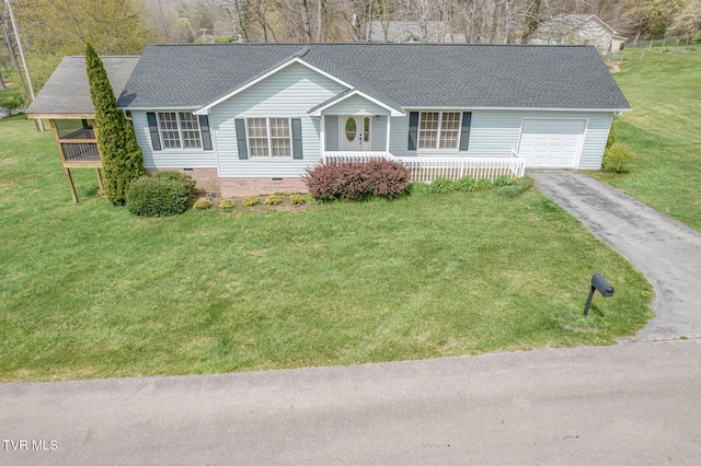 105 Buckner Dr, Roan Mountain, TN 37687 - ranch-style house featuring aphalt driveway, a front lawn, an attached garage, crawl space, and covered porch