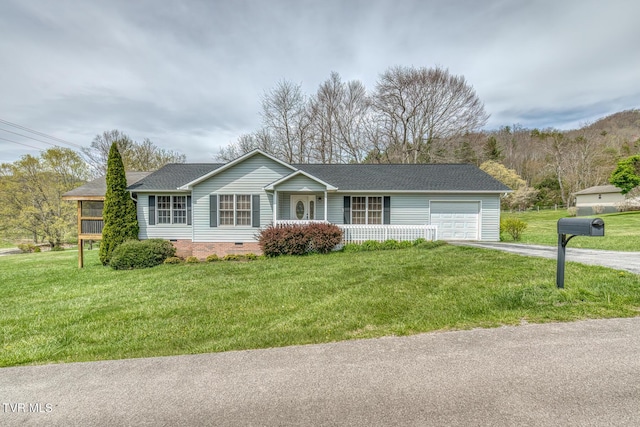 105 Buckner Dr, Roan Mountain, TN 37687 - single story home with driveway, covered porch, a garage, crawl space, and a front yard