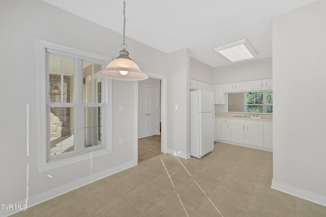 unfurnished dining area with sink