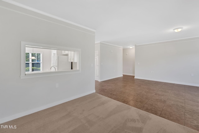 empty room with tile patterned floors and ornamental molding