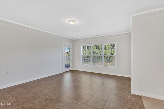 empty room with tile patterned flooring and crown molding