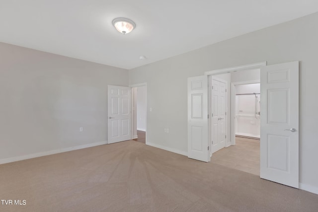 unfurnished bedroom with light colored carpet