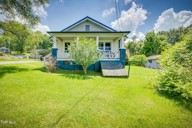 view of front facade with a front lawn and a porch