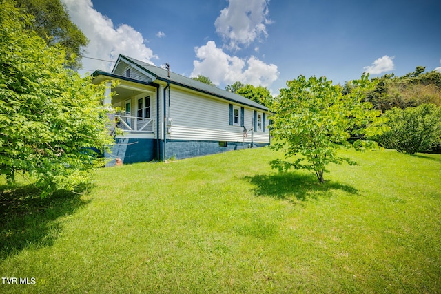 view of home's exterior with a yard