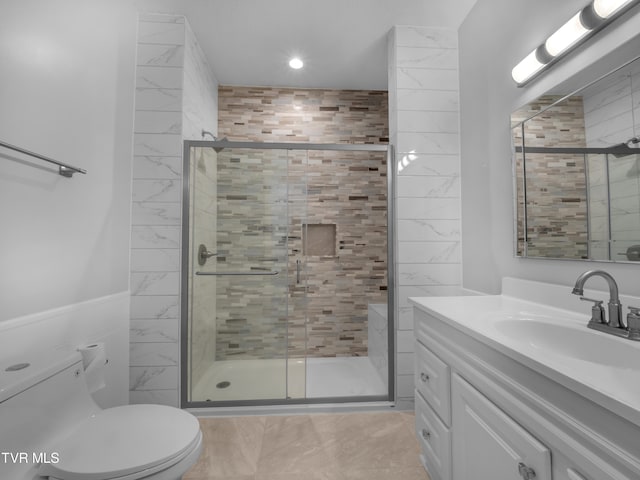 bathroom with vanity, toilet, walk in shower, and tile patterned flooring