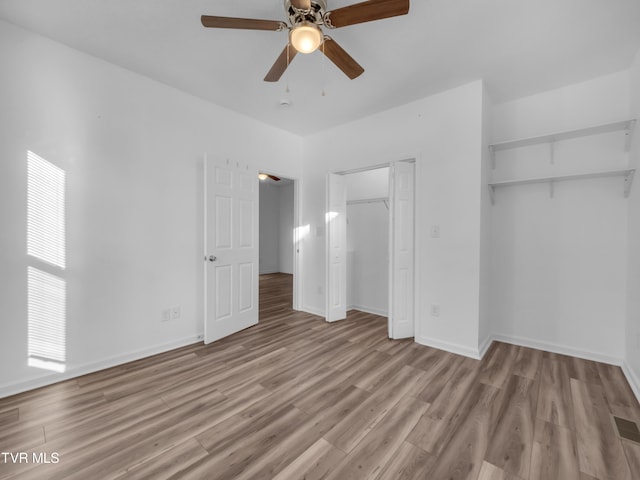 unfurnished bedroom featuring light hardwood / wood-style flooring and ceiling fan
