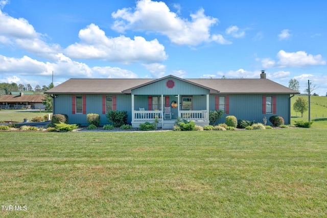 ranch-style house featuring a porch and a front yard