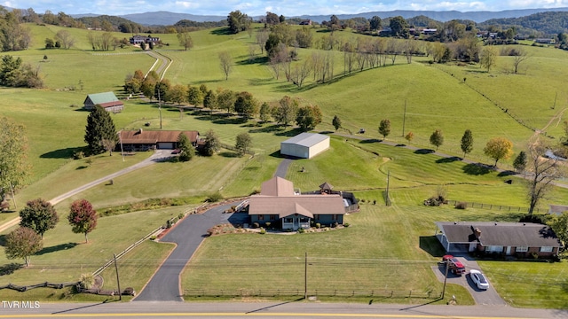 drone / aerial view featuring a rural view and a mountain view