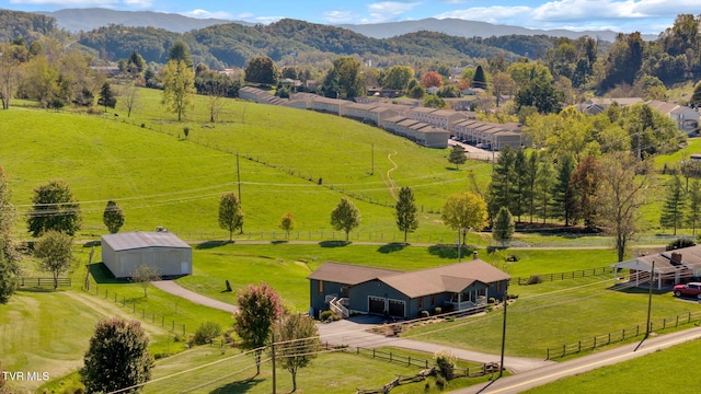 drone / aerial view featuring a mountain view and a rural view