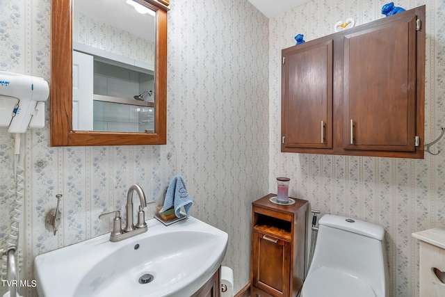 bathroom featuring an enclosed shower, sink, and toilet