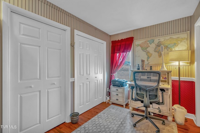 home office with hardwood / wood-style floors